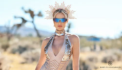 a woman wearing a born in stockholm costume at burning man