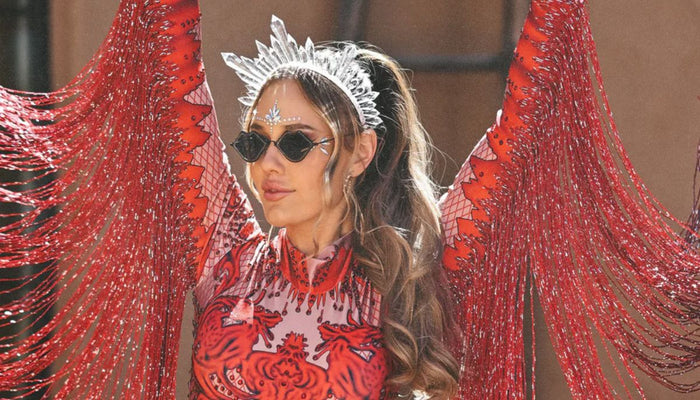 A woman at movement music festival wearing a born in stockholm outfit